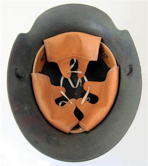 M16 23 - The shell is an original German, WW1 Model 1916 shell. . Ww1 german helmet liners